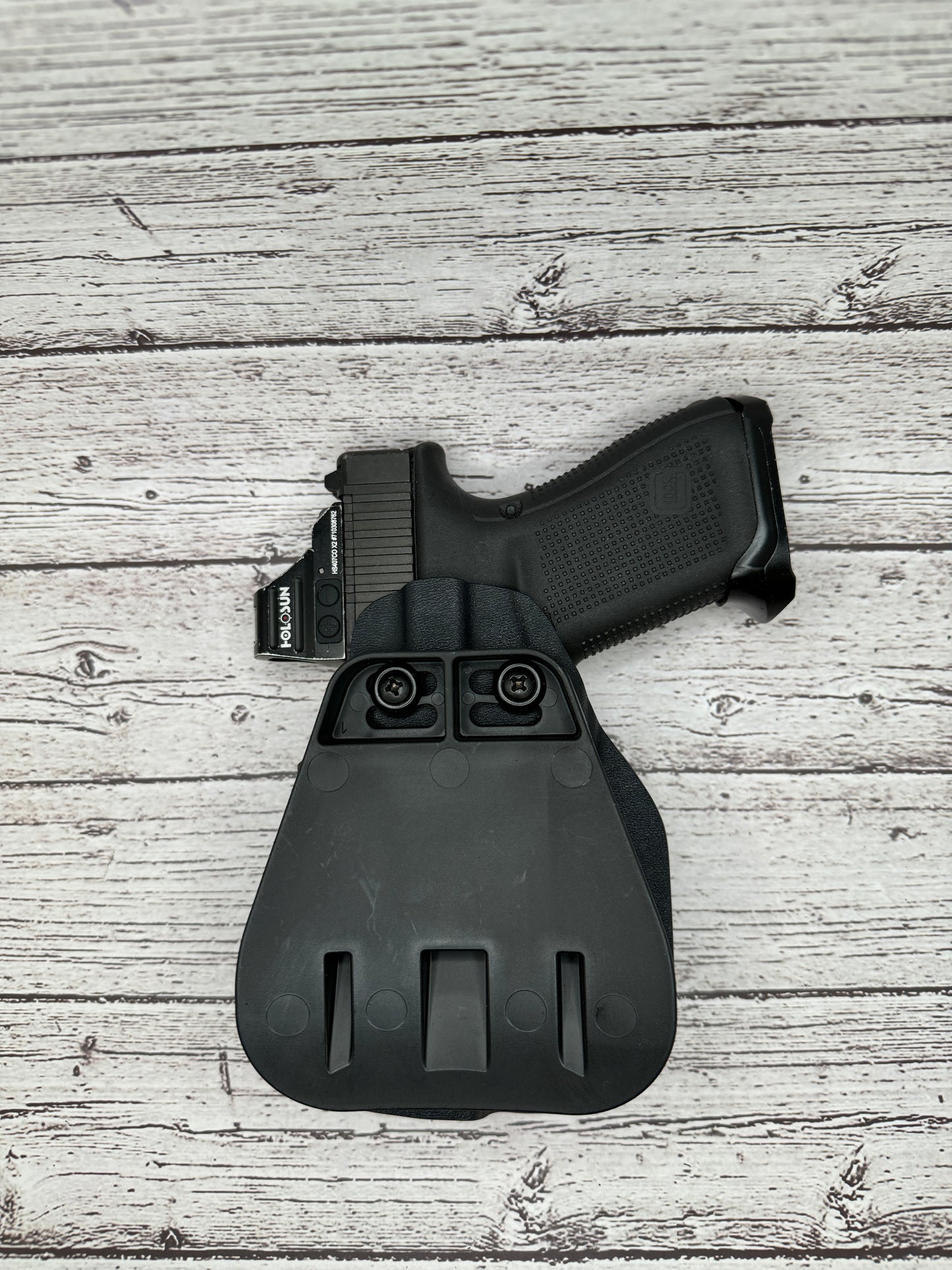 Light Bearing  OWB Paddle Holster for Glock 17 / 47  Pistol.