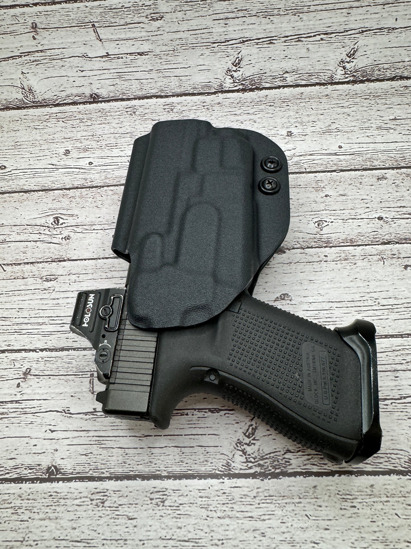 Light Bearing  OWB Paddle Holster for Glock 17 / 47  Pistol.