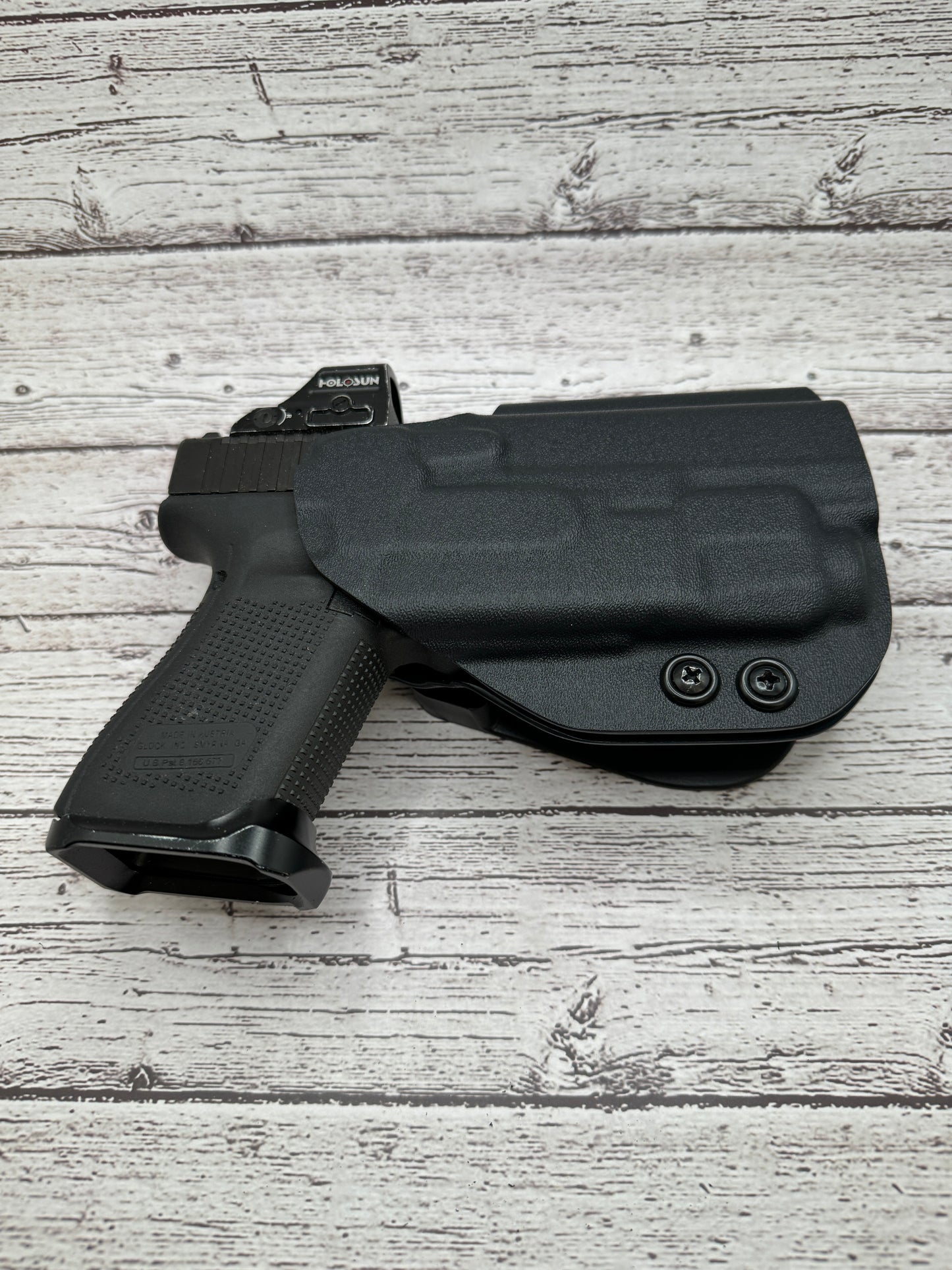 Light Bearing  OWB Paddle Holster for Glock 17 / 47  Pistol.