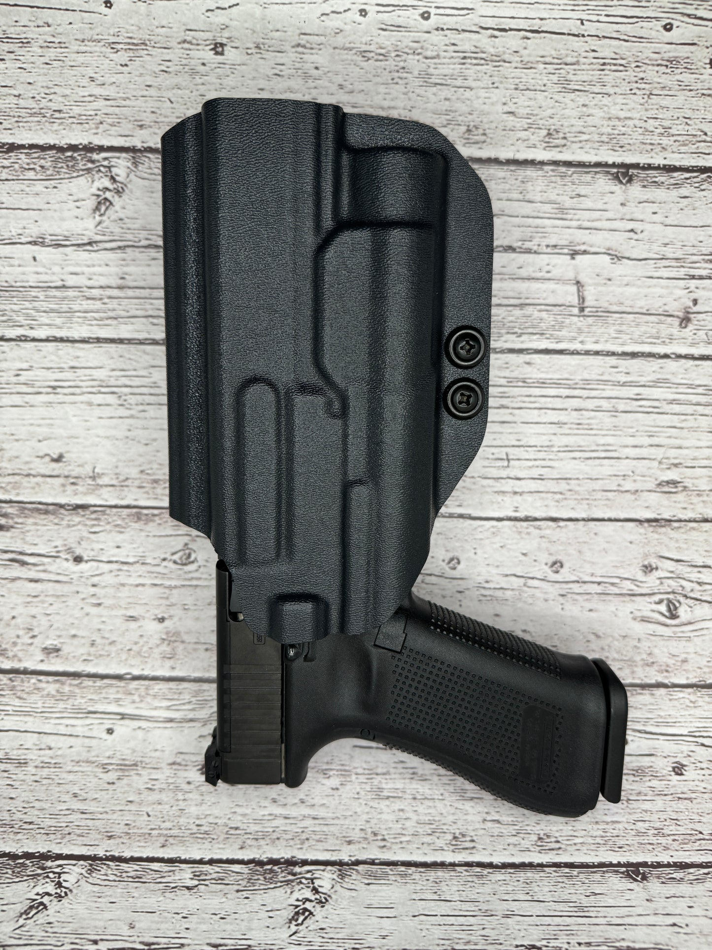 Light Bearing Paddle OWB Holster for Glock 34 Pistol .