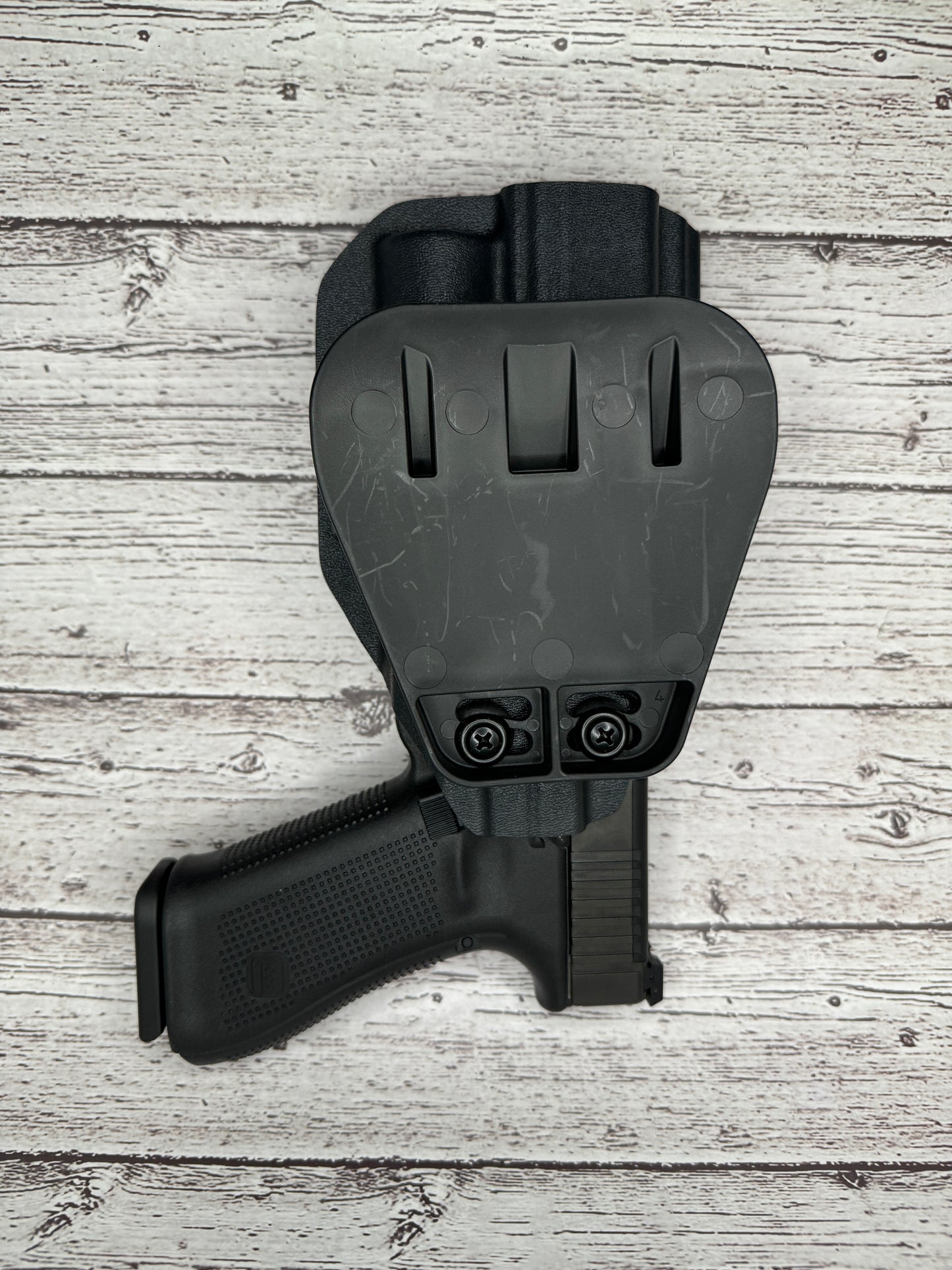 Light Bearing Paddle OWB Holster for Glock 34 Pistol .
