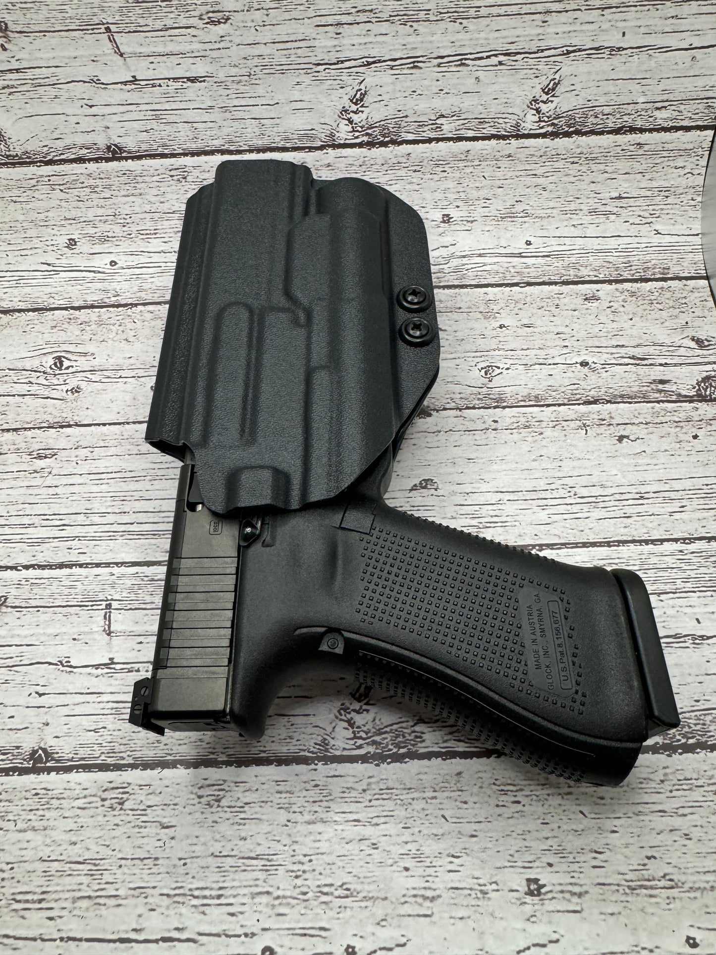Light Bearing Paddle OWB Holster for Glock 34 Pistol .