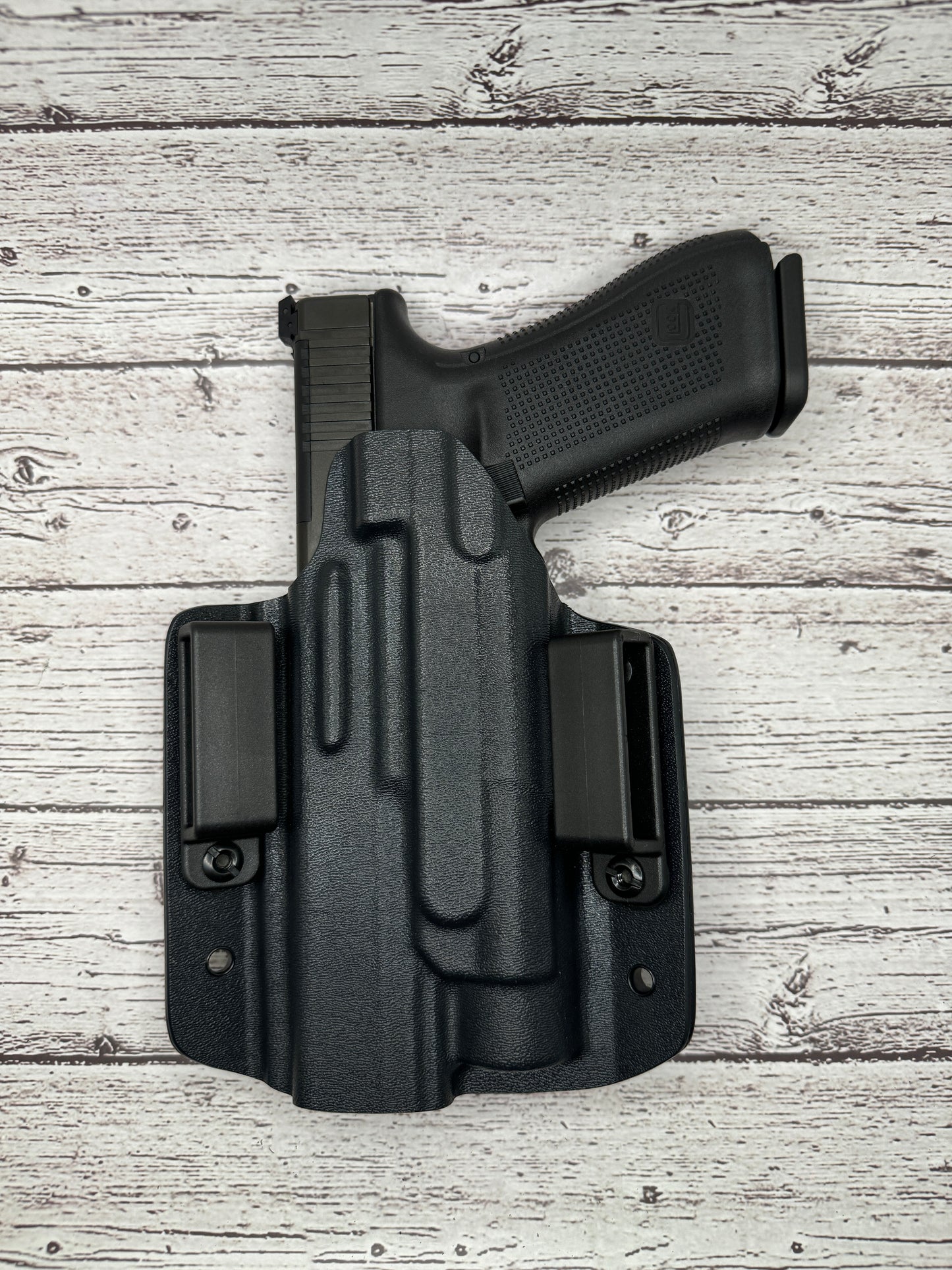 Light Bearing OWB Holster for Glock 34 Pistol .