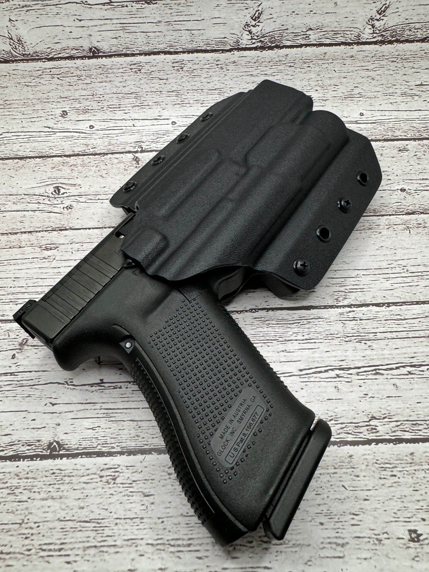 Light Bearing OWB Holster for Glock 34 Pistol .
